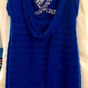 Form-fitting blue cocktail dress.Rhinestone embellishments